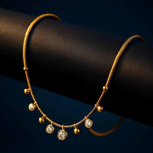 Quest Gold Necklace – close-up on dark cylindrical surface highlighting sparkle of zircon charms.