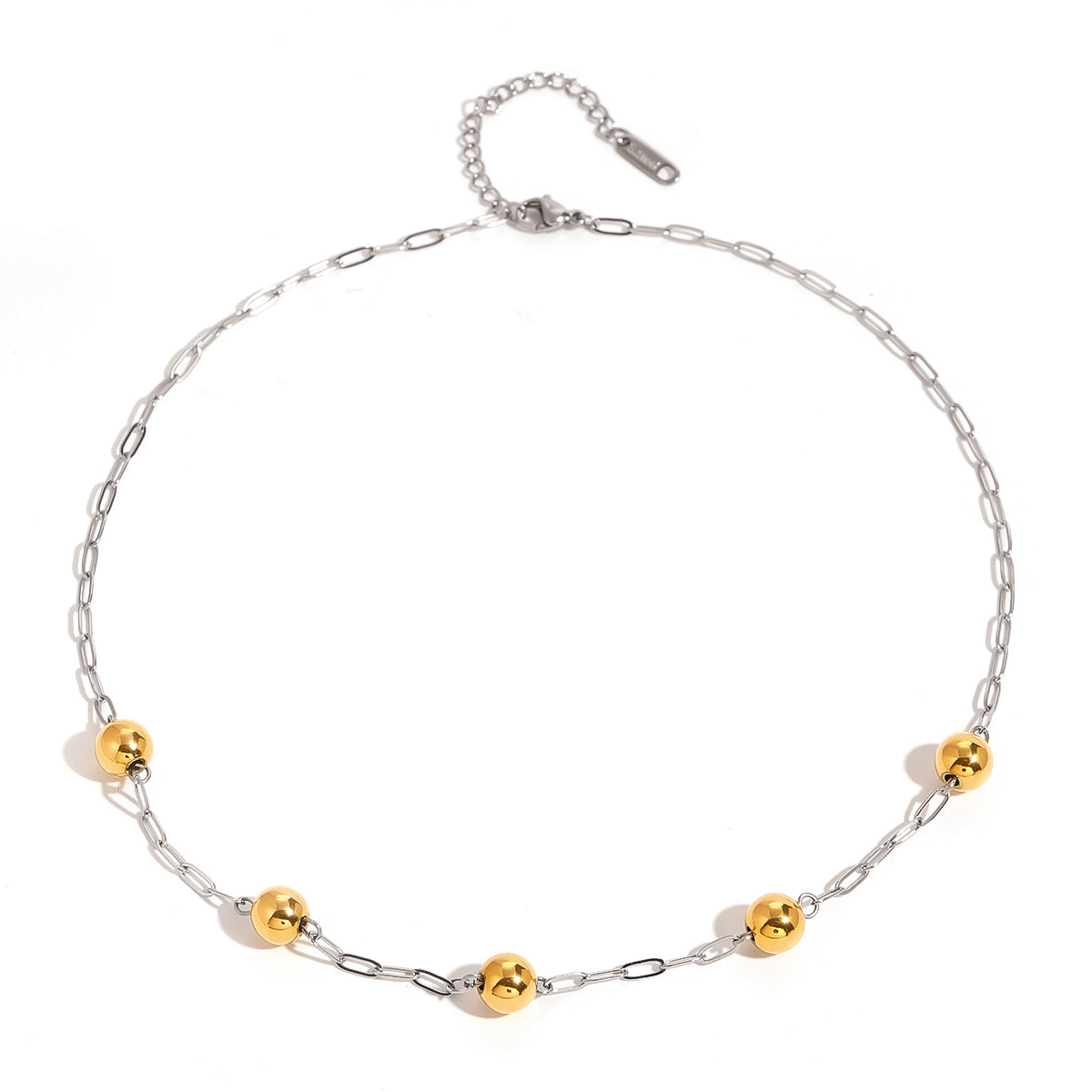 Two-tone silver chain with polished gold beads, flat lay on white background