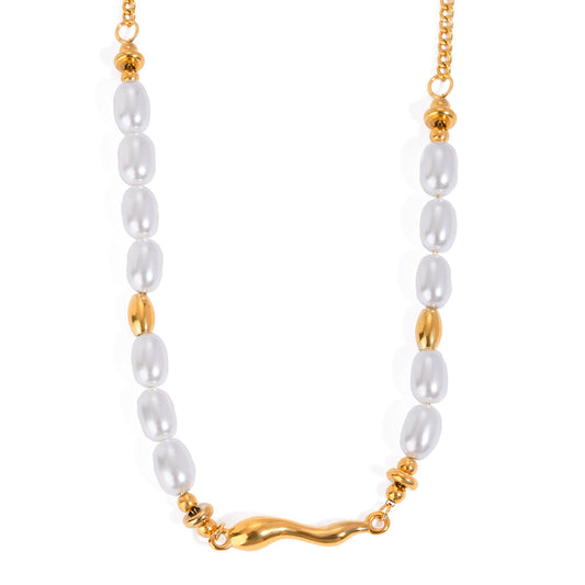 Elegant wavy gold centerpiece with oval pearls on gold-plated chain