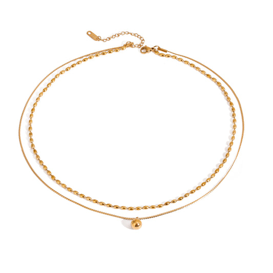 Eden Gold Necklace – double-layer bead chain with disc charm in 18K PVD gold plating on white background