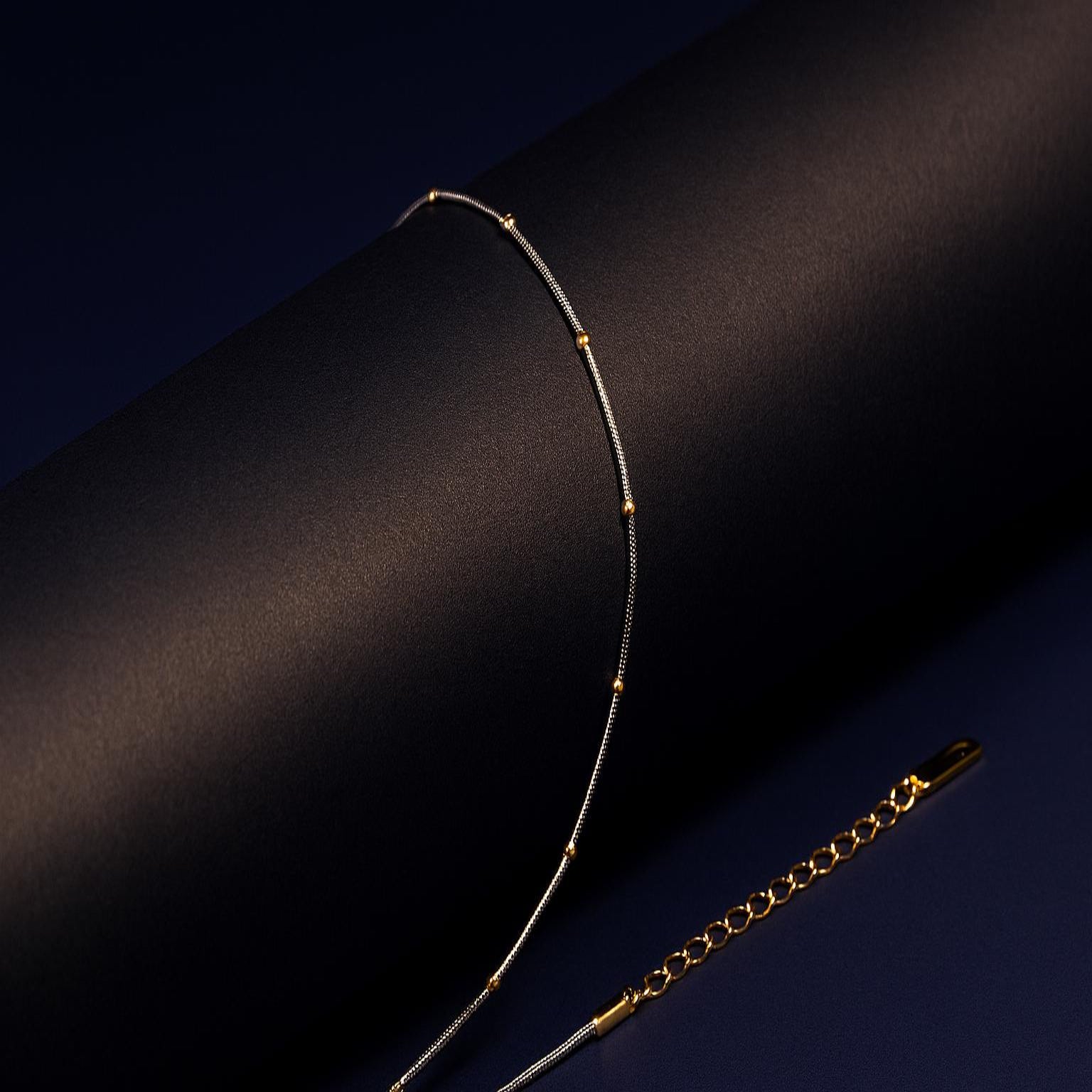Gold necklace on a dark background