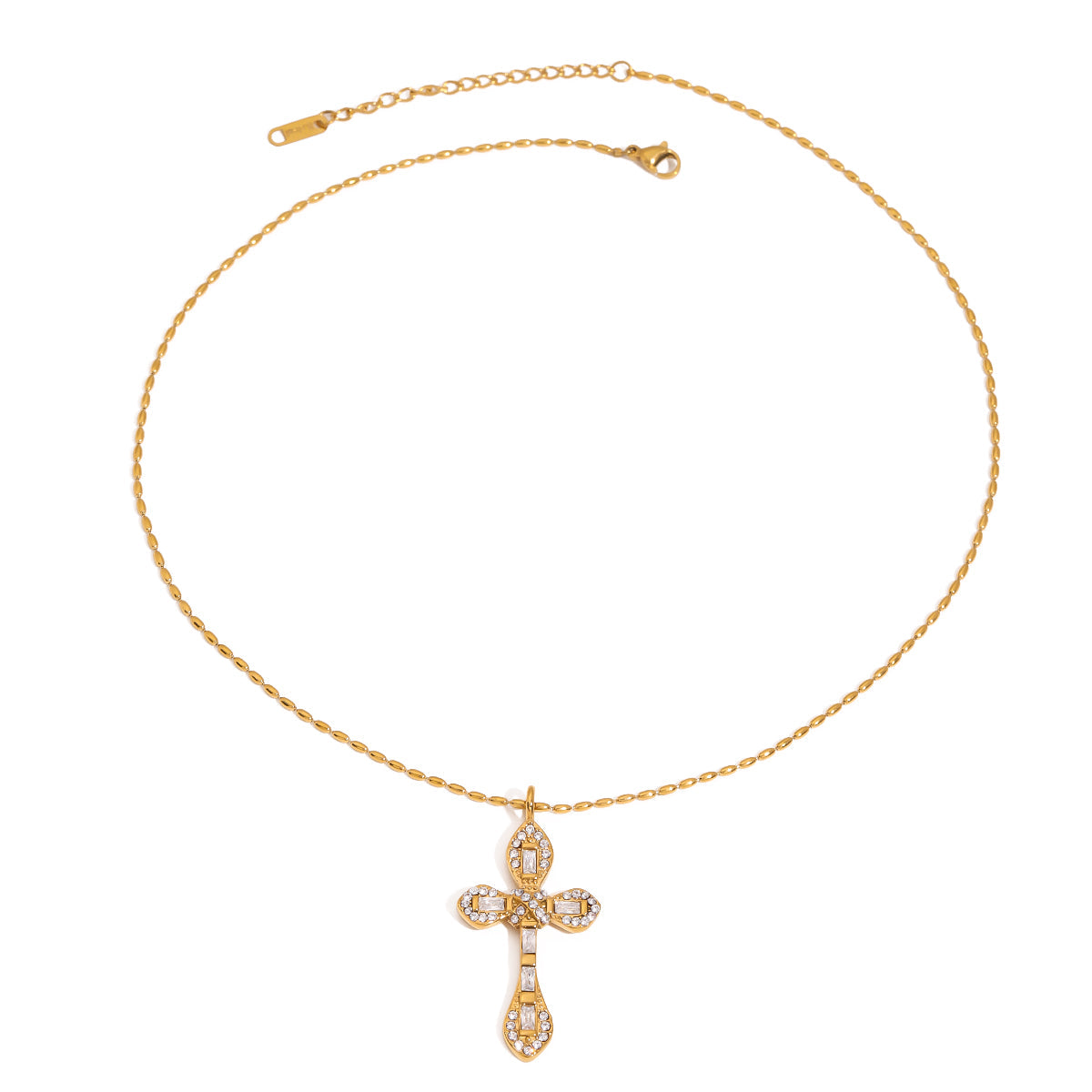 Talia Gold Necklace – crystal cross pendant on gold chain against white background