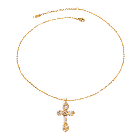 Talia Gold Necklace – crystal cross pendant on gold chain against white background