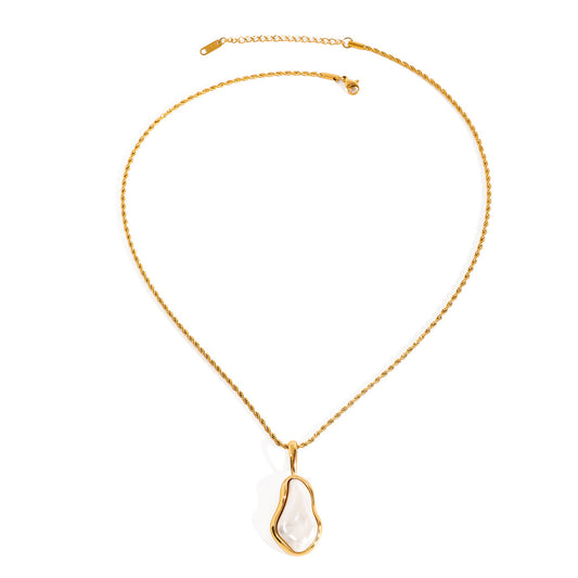 Sierra Gold Necklace – organic pearl pendant in gold frame on white background