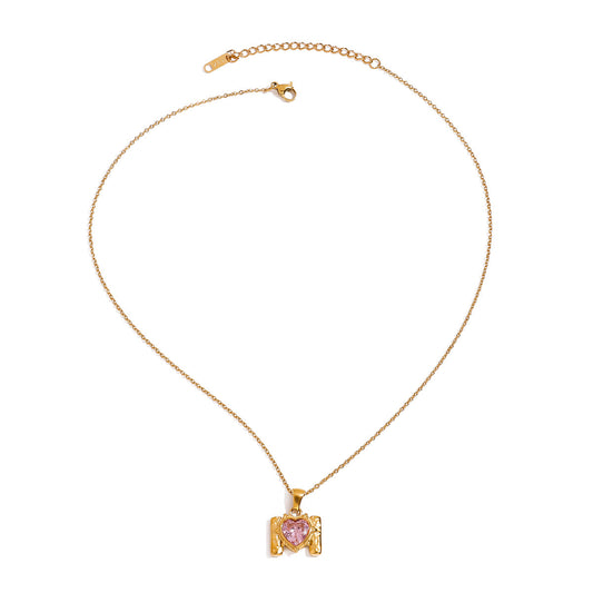 Pax Gold Necklace – gold chain with pink heart zircon pendant on white background