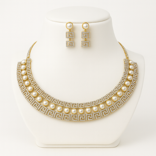 Fiamma Pura necklace set displayed on white bust stand, featuring pearls and Grecian CZ pattern