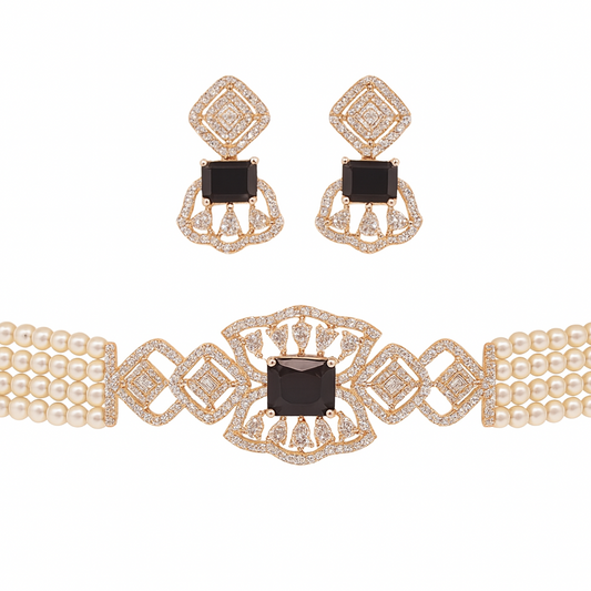 Flat lay of white pearl choker with black stone centre and matching earrings on white background