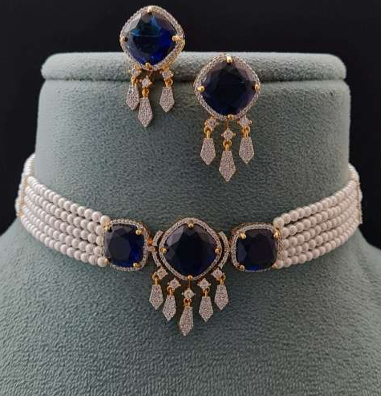  Eclat Noir blue stone pearl choker displayed on teal bust with matching earrings