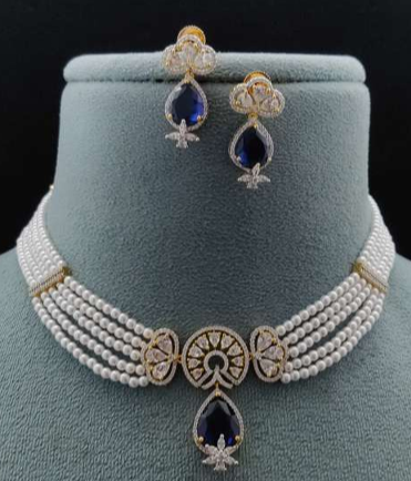  Silvia pearl and blue AD necklace with matching earrings on green velvet bust