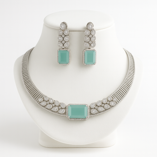 Front view of Sera necklace set on white bust with silver and mint finish