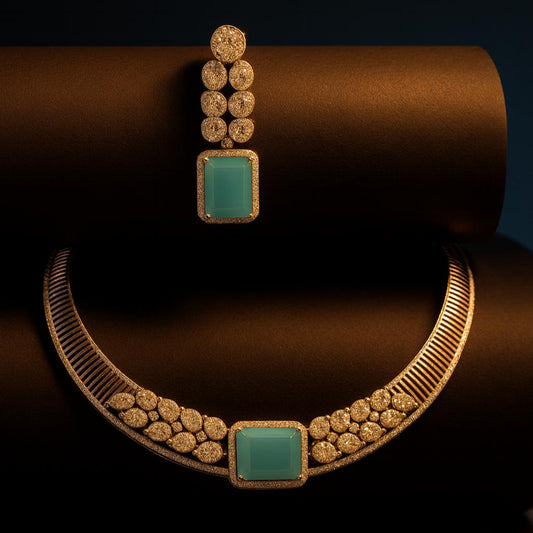 Editorial close-up of necklace and earring styled on black cylindrical surface with dramatic lighting