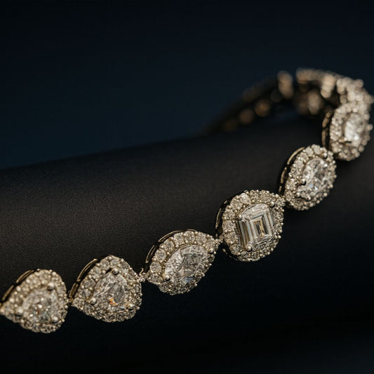 Silver-finished CZ bracelet with pear-shaped and round white stones, inspired by solitaire styling. Lightweight fashion jewelry piece by Lavish Jewels.