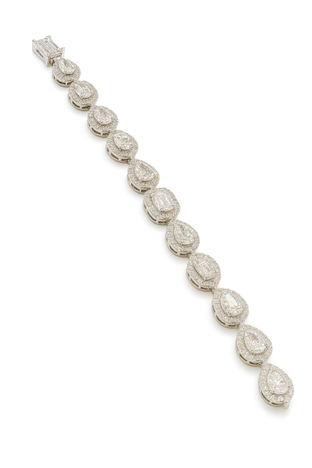 Silver-finished CZ bracelet with pear-shaped and round white stones, inspired by solitaire styling. Lightweight fashion jewelry piece by Lavish Jewels.