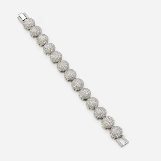 Silver-finished bracelet with round domed links, micro-set with American diamond-style CZ stones. Elegant fashion jewelry piece by Lavish Jewels.