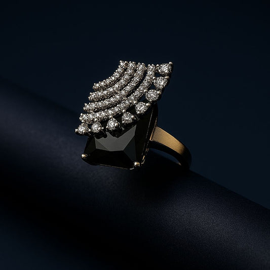 High-fashion image of black CZ ring with rhodium finish on dark gradient surface