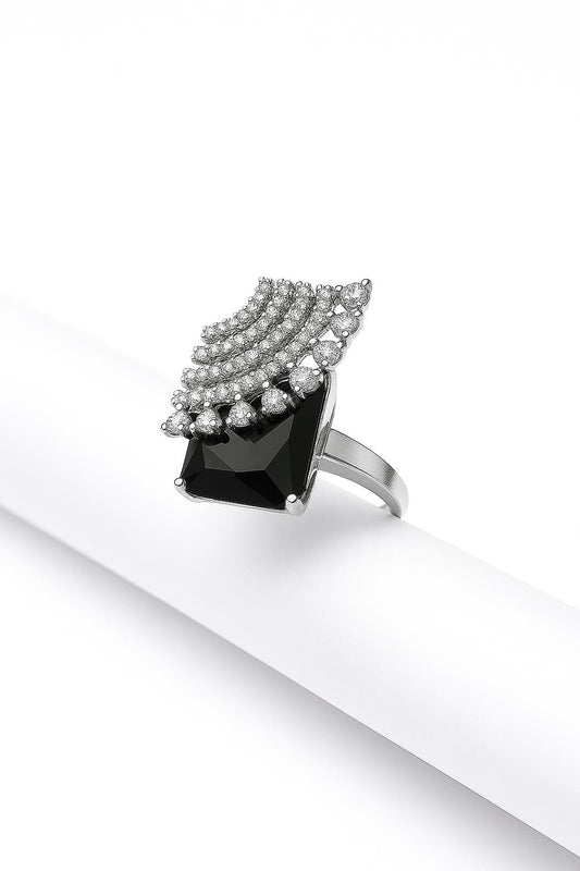 Studio-lit image showcasing fan-shaped CZ design of Vento d’Oro ring on white tube