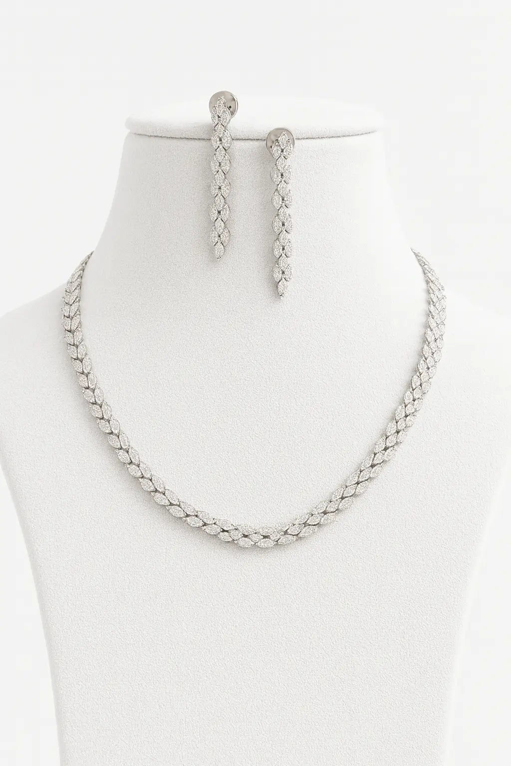 Baci AD Necklace Set - LAVISH JEWELSBaci AD Necklace Set – Silver Finish, Adjustable, Delicate Charm Design | Lavish Jewels