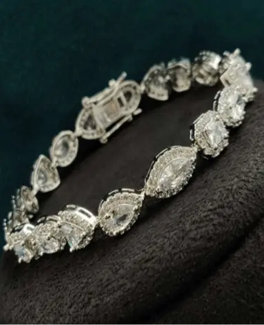 INAAYA WHITE CZ BRACELET - LAVISH JEWELSInaaya White CZ Bracelet – Silver Finish, Solitaire Style | Lavish Jewels