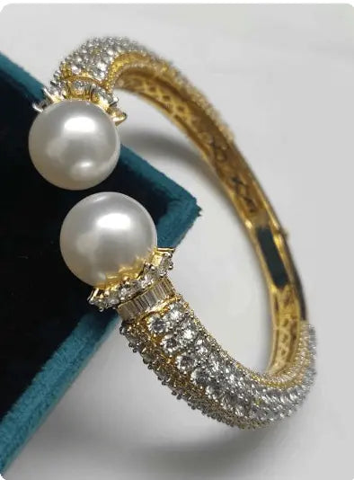 Lucina Ray – Pearl Elegant AD Kada | Gold White Plated Open Pearl Bracelet - LAVISH JEWELSLucina Ray – Pearl Elegant AD Kada | Gold White Plated Open Pearl Bracelet